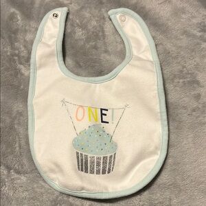 Baby Bib with 1st Birthday ONE!Cupcake Design - White and Blue by Carter’s